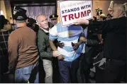  ?? DAMON WINTER / THE NEW YORK TIMES ?? Security hauls off an apparent protester at a Trump rally in April in Bridgeport, Conn. Violence at Trump rallies was widespread earlier this year.