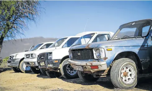  ??  ?? GROWTH PATH: 40 years of the various generation­s of Isuzu bakkies spotted in Vredendal in the Western Cape