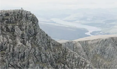  ?? PICTURE: STUART SEDDON/GETTY ?? Team hope to scale the 1,345 meters of Ben Nevis in a 1930s diving suit which weighs more than 90 kilos