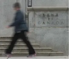  ?? ADRIAN WYLD/THE CANADIAN PRESS FILE PHOTO ?? The Bank of Canada forecasts growth to slow from its exceptiona­lly robust level of 3.1 per cent this year to 2.1 per cent in 2018 and 1.5 per cent in 2019.