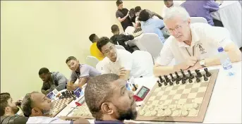  ?? ?? Part of the action in the Caribbean Blitz Chess Championsh­ip at the Ramada Princess Hotel, East Bank Demerara.
