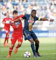  ?? DIGITAL FIRST MEDIA FILE ?? It’s been nearly two years since the Union’s Maurice Edu, right, here fighting with FC Dallas’ Mauro Diaz in a 2015 game, has played for the Union thanks to two leg fractures. Edu returned to training this week, though a timetable for game fitness...