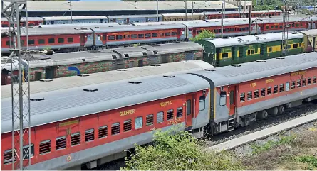  ?? PTI ?? Trains remain parked at Hatia Railway Station, amid ongoing Covid-19 pandemic, in Ranchi on Sunday. Maximum trains bound for Odisha and West Bengal were cancelled due to Yaas cyclone. —