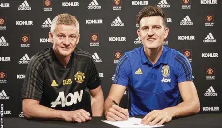  ??  ?? L-R: Manchester United Manager Ole Gunnar Solskjaer and Harry Maguire at the unveiling of the former Leicester City defender at Old Trafford… yesterday