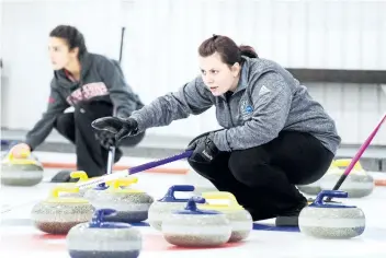  ?? SUPPLIED PHOTO ?? St. Catharines native and E.L. Crossley graduate Emma Caldwell, foreground, shown competing at the Niagara Invitation­al Bonspiel in this file photo, skipped the Niagara College Knights to the silver medal at the college curling championsh­ips in Sault...