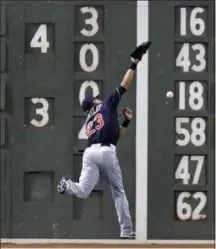  ?? CHARLES KRUPA — ASSOCIATED PRESS ?? Michael Brantley leaps for but cannot make the play on a double by the Red Sox’s Eduardo Nunez during the seventh inning July 31 in Boston.