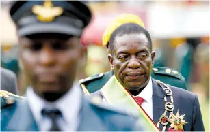  ?? (Siphiwe Sibeko/Reuters) ?? EMMERSON MNANGAGWA walks after he was sworn in as Zimbabwe’s president in Harare on Friday.