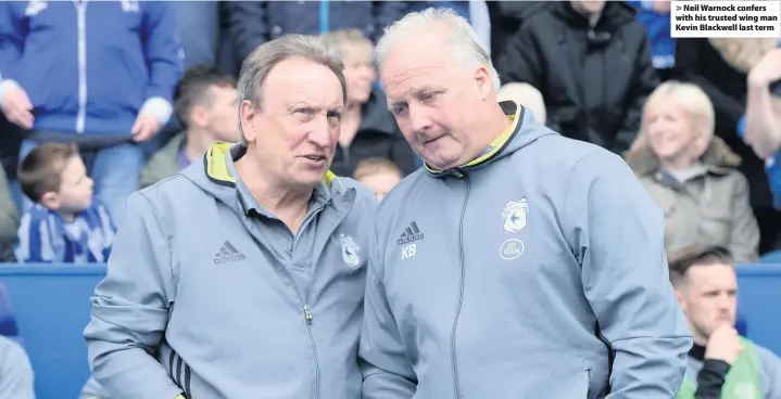  ??  ?? > Neil Warnock confers with his trusted wing man Kevin Blackwell last term