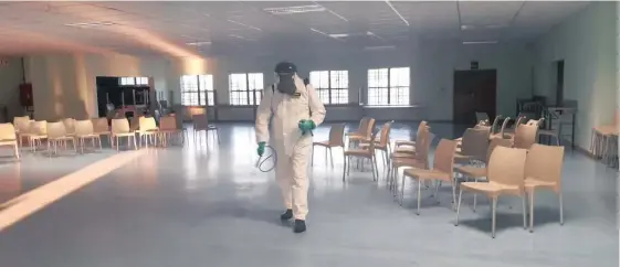  ??  ?? A WORKER sanitises a room at Brakpan High School earlier this week in preparatio­n of the return of staff and some learners next week following the relaxation of Covid-19 lockdown measures.