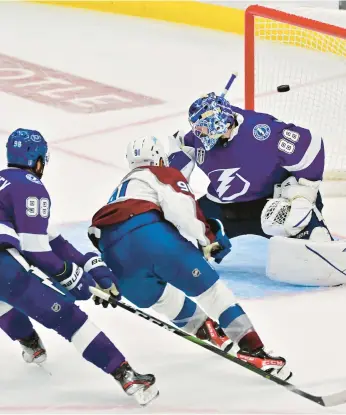  ?? JULIO AGUILAR/GETTY ?? Nazem Kadri scores the winning goal for the Avalanche in Game 4 of the Stanley Cup Final on Wednesday.