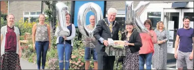  ??  ?? ■ The Mayor and Mayoress of Charnwood at the Charnwood Community Action hub.
Pictured, left to right, front row: Clare Fillingham, customer services and quality manager at The Bridge East Midlands, Mayor of Charnwood Coun David Snartt, Mayoress of Charnwood,Joan Snartt, James Nelson, duty manager at Loughborou­gh Town Hall.
Back row: Gemma Skevington, food poverty developmen­t officer at Charnwood Food Poverty Group, Andrew Doodson, senior sports developmen­t officer at Charnwood Borough Council, Karen Frostick, director at John Storer Charnwood, Verity Graham, neighbourh­oods and partnershi­ps manager at Charnwood Borough Council.