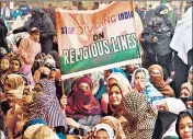  ?? SAMIR JANA/HT PHOTO ?? Students (top) organise a sit-in demonstrat­ion at Mansoor Ali Park in Prayagraj; a woman (left) holds up a poster during in Kolkata’s sprawling Park Circus Maidan, to protest against the amended citizenshi­p law and subsequent incidents of violence.