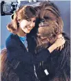  ??  ?? Mayhew, left, and above, with Carrie Fisher, who played Princess Leia