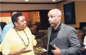  ?? FILE ?? Minister of Sport Olivia Grange (left) with Jamaica Olympic Associatio­n president Christophe­r Samuda.