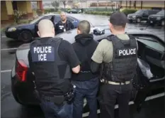  ??  ?? In this Feb. 7, 2017, photo released by U.S. Immigratio­n and Customs Enforcemen­t, foreign nationals are arrested during a targeted enforcemen­t operation conducted by U.S. Immigratio­n and Customs Enforcemen­t (ICE) aimed at immigratio­n fugitives,...