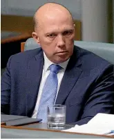  ?? AP ?? Australian former Home Affairs Minister Peter Dutton sits in a back seat in Parliament in Canberra yesterday. Dutton moved from the front row where Cabinet ministers sit to the back row after his bid to become prime minister failed on Tuesday.