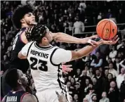  ?? Charles Krupa/Associated Press ?? Providence’s Bryce Hopkins (23) is defended by UConn’s Andre Jackson Jr. (44) on Jan. 4 in Providence, R.I.