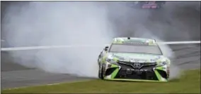  ?? AMANDA NEWMAN — THE ASSOCIATED PRESS ?? Kyle Busch spins in Turn 2 during a NASCAR Cup Series auto race at Charlotte Motor Speedway in Concord, N.C., Sunday.