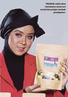  ??  ?? PRODUK coklat Aina membantu ramai suri rumah dan pelajar tambah
pendapatan.