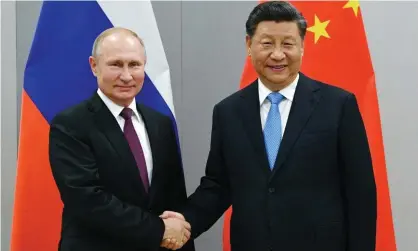  ?? Photograph: Ramil Sitdikov/AP ?? Vladimir Putin and Xi Jinping pose for a photograph before their talks in Beijing, China.