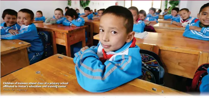  ?? Photo: Fan Lingzhi/GT ?? Children of trainees attend class at a primary school affiliated to Hotan’s education and training center.