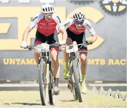  ?? Picture: GREG BEADLE/CAPE EPIC/SPORTZPICS ?? ELITE ASSAULT: Nicola Rohrbach, left, and Daniel Geismayr, of team Centurion Vaude, win the Prologue of the Absa Cape Epic Mountain Bike stage race in Cape Town yesterday