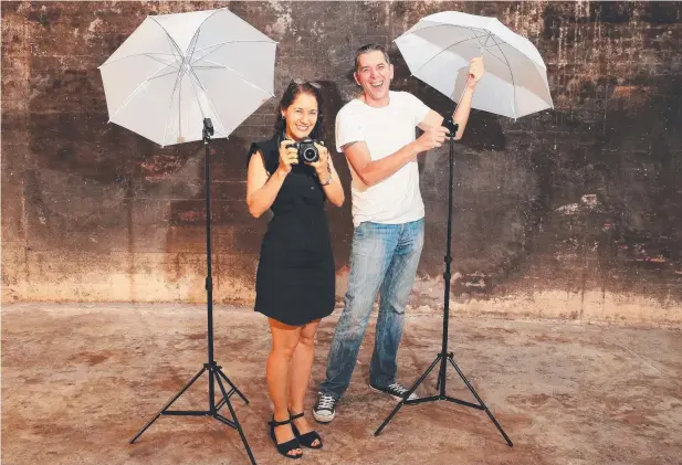  ?? Picture: JUSTIN BRIERTY ?? SNAP HAPPY: Cairns’ Artistic Photograph­y’s Jen Frei and Marc Steiner are prepared for the group’s Social Shoot Soiree on Saturday.