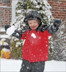  ?? PETE BANNAN – DIGITAL FIRST MEDIA ?? Jackson Spano, 4, was one of the few people cheering the spring snowstorm that made his Drexel Hill home so much fun Wednesday afternoon. He was outside with his dad, Mark, and brother Dean throwing snowballs and sledding.