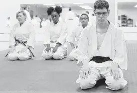  ?? Elizabeth Conley photos / Houston Chronicle ?? Mike Griffith, who has autism, has advice for those with special needs who might like to try karate: “Go for it, but keep in mind that it is a big commitment.”
