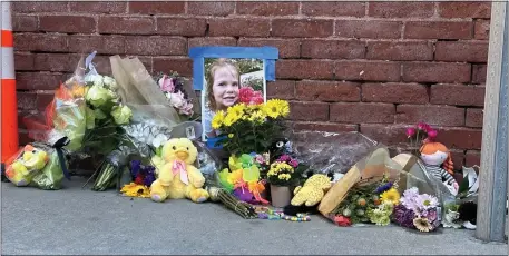  ?? CHRIS VAN BUSKIRK — BOSTON HERALD ?? A memorial at the intersecti­on of Sleeper and Congress Streets where 4-year-old Gracie Gancheva was killed after being hit by a vehicle, as seen Saturday. The City of Boston plans to make temporary safety upgrades to the South Boston intersecti­on.