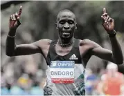  ?? Elizabeth Conley / Houston Chronicle ?? Kenya’s Dominic Ondoro breaks the tape first to win the Chevron Houston Marathon on Sunday.