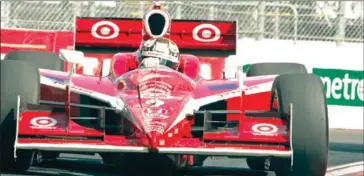  ?? AFP ?? Kiwi Scott Dixon took the chequered flag at the Genesys 300, IndyCar’s first main event.