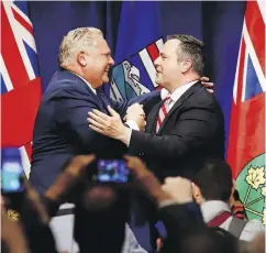  ?? THE CANADIAN PRESS/FILES ?? Ontario Premier Doug Ford, left, and United Conservati­ve Leader Jason Kenney are joining forces in opposing the federal carbon tax.