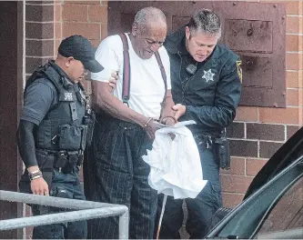  ?? JOSE F. MORENO TNS ?? Bill Cosby is escorted by police in handcuffs as he leaves the Montgomery County Correction­al Facility in Norristown, Pa., on Tuesday.