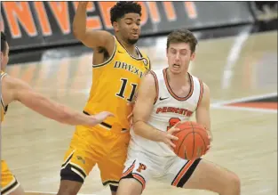  ?? KYLE FRANKO — TRENTONIAN PHOTO ?? Princeton’s Ryan Langborg (3) tries to move past Drexel’s Camren Wynter (11) during a NCAA men’s basketball game at Jadwin Gymnasium.