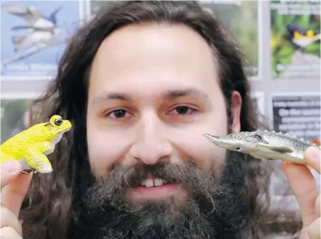  ?? NICK BRANCACCIO ?? Graduate biology student Lincoln Savi displays some of his robotic creations at the University of Windsor on Monday. In April Savi started his own business — Savi Made — making life-like 3D-printed animals for research and teaching applicatio­ns.