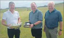  ?? ?? The winners of Dunaverty Golf Club’s gents’ Amod MacNeill pairs competitio­n, Kenneth Johnstone, left, and Robert MacKay, centre, recently received their prizes from club caption Willie Young, right.