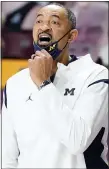  ?? JIM MONE — THE ASSOCIATED PRESS ?? Coach Juwan Howard and Michigan remained seventh in the latest Associated Press Top 25.