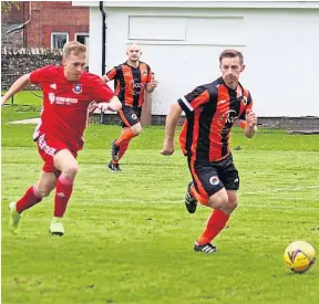  ?? ?? Attack Doune’s Lukasz Duszunski (right) takes on the Sandys defence