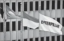  ?? [THE ASSOCIATED PRESS] ?? Flags fly at the Caterpilla­r global headquarte­rs in Peoria, Illinois. Caterpilla­r recently decided to move its top headquarte­r jobs to the Chicago area, leaving a vacuum in Peoria. The same has happened to many mid-size communitie­s where companies had...