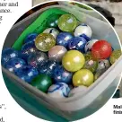  ?? MAIN PHOTO: CAMERON BURNELL/STUFF; INSET: GETTY IMAGES ?? Malcolm Wayman recalls the moment he saved a 4-year-old boy choking on a marble on the side of the road, two days after he finished his St John first-aid training. Marbles, like those pictured inset, are a common choking hazard for children.