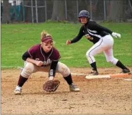  ?? ANNE NEBORAK — DIGITAL FIRST MEDIA ?? Chichester first baseman Hayley Coale awaits a pitch with Interboro’s Barb Carosi on base. The Bucs won the Del Val League opener, 15-1. Check page 72 for the full game story.