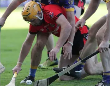  ??  ?? Oulart-The Ballagh midfielder David Redmond in the thick of the action.