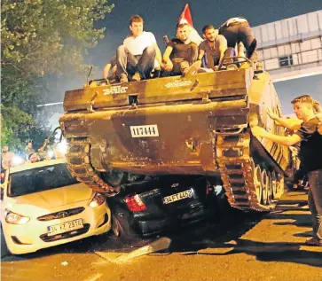  ?? Picture: EPA ?? CRUSHED: Civilians ride on army tanks in Istanbul after the military coup in Turkey failed on Friday night