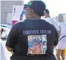  ?? BARBARA HADDOCK TAYLOR/BALTIMORE SUN ?? Angel Gray, who is an aunt of Taylor Hayes, joined dozens of relatives and friends of the family of the 7-year-old, who was killed last summer, as they attended a peace walk in her honor in the Edmondson Village neighborho­od.