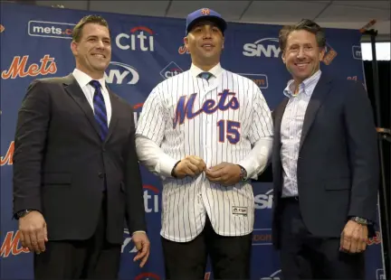  ?? SETH WENIG — ASSOCIATED PRESS FILE ?? Carlos Beltran, center, is photograph­ed with general manager Brodie Van Wagenen, left, and Mets Chief Operating Office Jeff Wilpon during a news conference on Nov. 4, 2019, at Citi Field in New York.