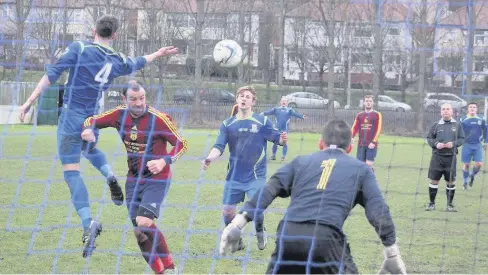  ??  ?? Llan’s Dan Thomas (No4) looked to be nudged off the ball by Greenfield’s Tony Hobson in this incident. Picture: ELFRYN OWEN