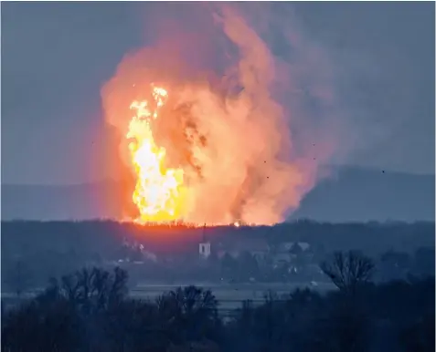  ??  ?? A column of fire is seen after an explosion ripped through Austria’s main gas pipeline hub in Baumgarten. The UK Government now faces questions about energy security