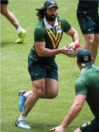  ?? PHOTO: GLENN HUNT/AAP ?? PROPPED UP: Front-rower Aaron Woods takes the defensive line on during a Kangaroos training session.