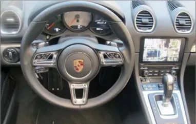  ??  ?? The interior of the 718 Porsche Boxster is primarily driver oriented.